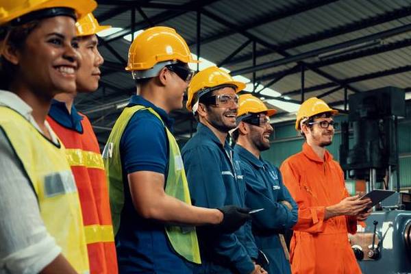 Skillful workers attending training in a factory