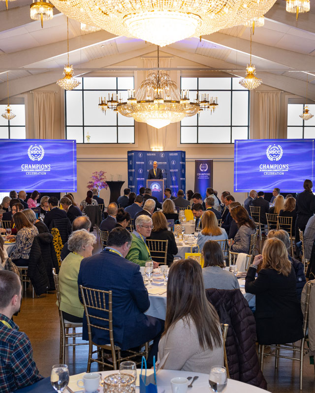 Champions Awards Celebration attendees seated while listening to the event speaker in the Harborview Ballroom at Danversport.