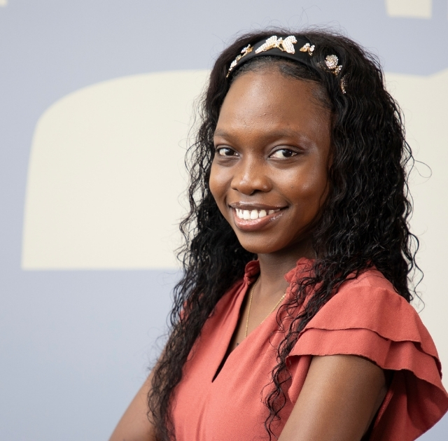 Portrait of NSCC female student smiling in front of wall