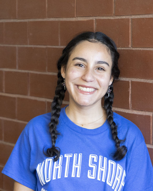 Portrait of NSCC female graduate smiling holding flowers