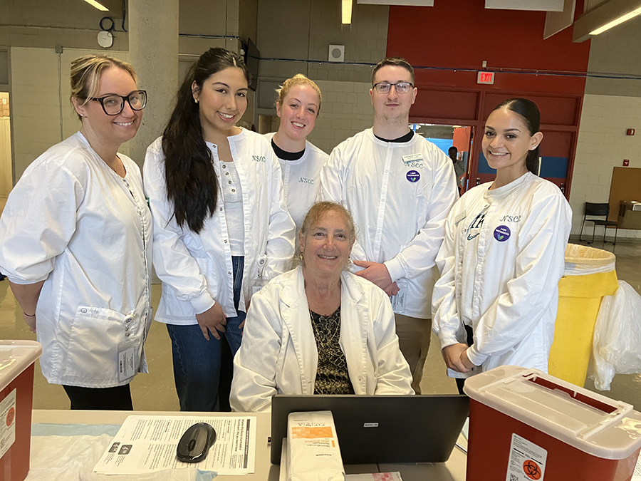 nursing students administer flu shots